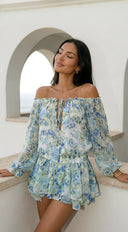 Cyrene Floral Off-Shoulder Mini Dress in Shoulder Mini Dress - Floral Green detail shot of stitching and finish hemline