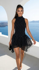 Colette Polka Dot High Neck Mini Dress in Black fabric drape close-up hemline and silhouette detail