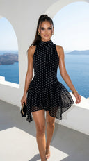 Colette Polka Dot High Neck Mini Dress in Black close-up of fabric and construction hemline and silhouette d additional angle