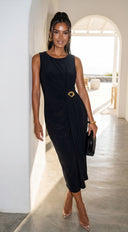 Aureva Pleated Gold Accent Midi Dress in Black hemline and silhouette detail