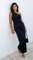 Caldera Linen One Shoulder Set in Black fabric drape close-up hemline and silhouette detail