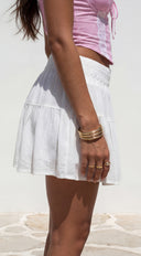 Calypsea Crinkle Gauze Tiered Mini Skort in White styled outfit flat lay