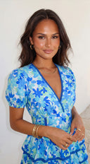 Solira Floral Tiered Mini Romper Dress in Blue side profile view on model