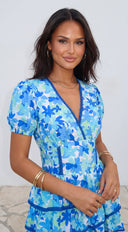 Solira Floral Tiered Mini Romper Dress in Blue close-up of neckline and shoulder detail