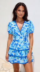 Solira Floral Tiered Mini Romper Dress in Blue hemline and silhouette detail