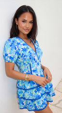 Solira Floral Tiered Mini Romper Dress in Blue full length three-quarter angle