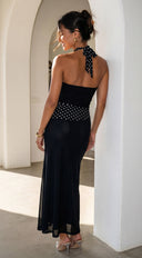 Zelara Polka Dot Twist Halter Maxi Dress in Black side profile view on model