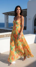 Nayira Floral Pleated Strapless Maxi Dress in Orange Multi detail shot of strap detail hemline and silhouett additional angle