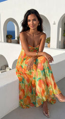 Nayira Floral Pleated Strapless Maxi Dress in Orange Multi side profile view on model