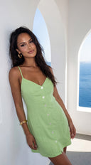 Elira Linen Mini Dress in Lime Green side profile view on model