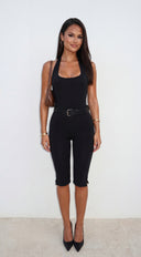 Neraya Scoop Halter Capri Jumpsuit in Black stitching and texture close-up hemline and silhouette detail