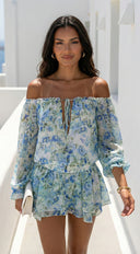 Cyrene Floral Off-Shoulder Mini Dress in Shoulder Mini Dress - Floral Green close-up of floral print hemline additional angle