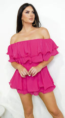 Karli Off Shoulder Ruffled Romper in Pink side profile view on model