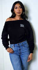 Kali Off Shoulder Sweater in Black full length front view on model