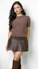 Vex Faux Leather Pleated Mini Skirt in Brown close-up of faux leather finish