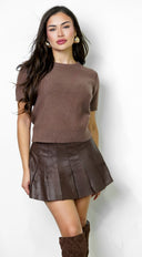 Vex Faux Leather Pleated Mini Skirt in Brown full length front view on model