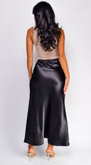 Ophelia Satin Slip Midi Skirt in Black side profile view on model