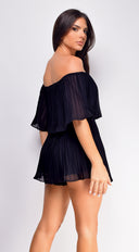 Jazmin Off Shoulder Pleated Romper in Black close-up of neckline and shoulder detail