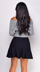 Solana Pleated Mini Skirt in Black side profile view on model