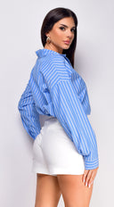Manda Pleated Shorts in White side profile view on model