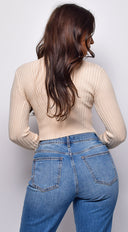 Astraia Basic Turtle Neck Crop Ribbed Sweater Top in Beige side profile view on model
