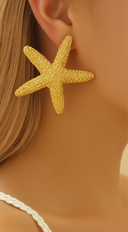 Starfish Earrings in Gold on neutral background