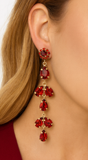 Tia Long Drop Crystal Chandelier Earrings in Red on neutral background