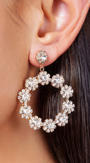 Rhinestone Flower Circle Dangle Earrings in Gold on neutral background