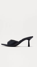 Malina Heeled Mules in Black close-up of heel and sole detail