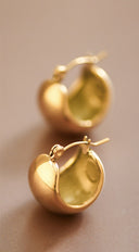LuxeVault 18K Gold Dipped Hoop Earrings on neutral background