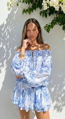 Bahama Floral Off Shoulder Ruffle Mini Dress in Blue collar and strap construction