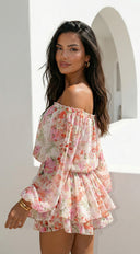 Cyrene Floral Off-Shoulder Mini Dress in Shoulder Mini Dress - Floral Pink close-up of floral print hemline and