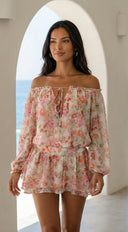 Cyrene Floral Off-Shoulder Mini Dress in Shoulder Mini Dress - Floral Pink fabric drape close-up hemline and s texture detail