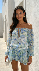 Cyrene Floral Off-Shoulder Mini Dress in Shoulder Mini Dress - Floral Green fabric drape close-up hemline an additional angle