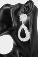 Silver Textured Open Teardrop Dangle Earrings on neutral background
