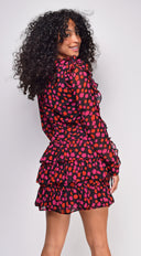 Anahi Black Floral Print Ruffle Mini Dress side profile view on model